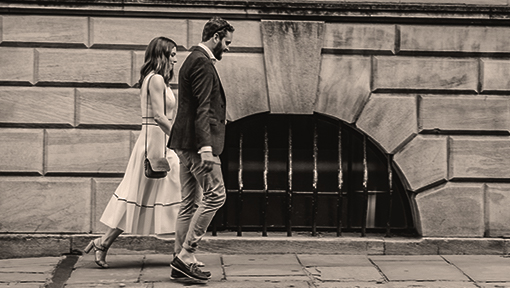 Professional couple walking along the city streets